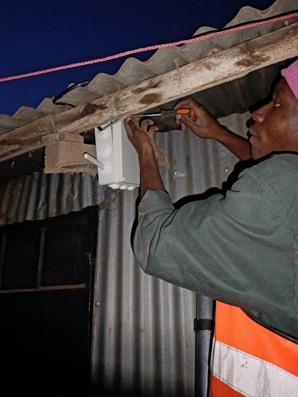 Africynet technician installing an access point