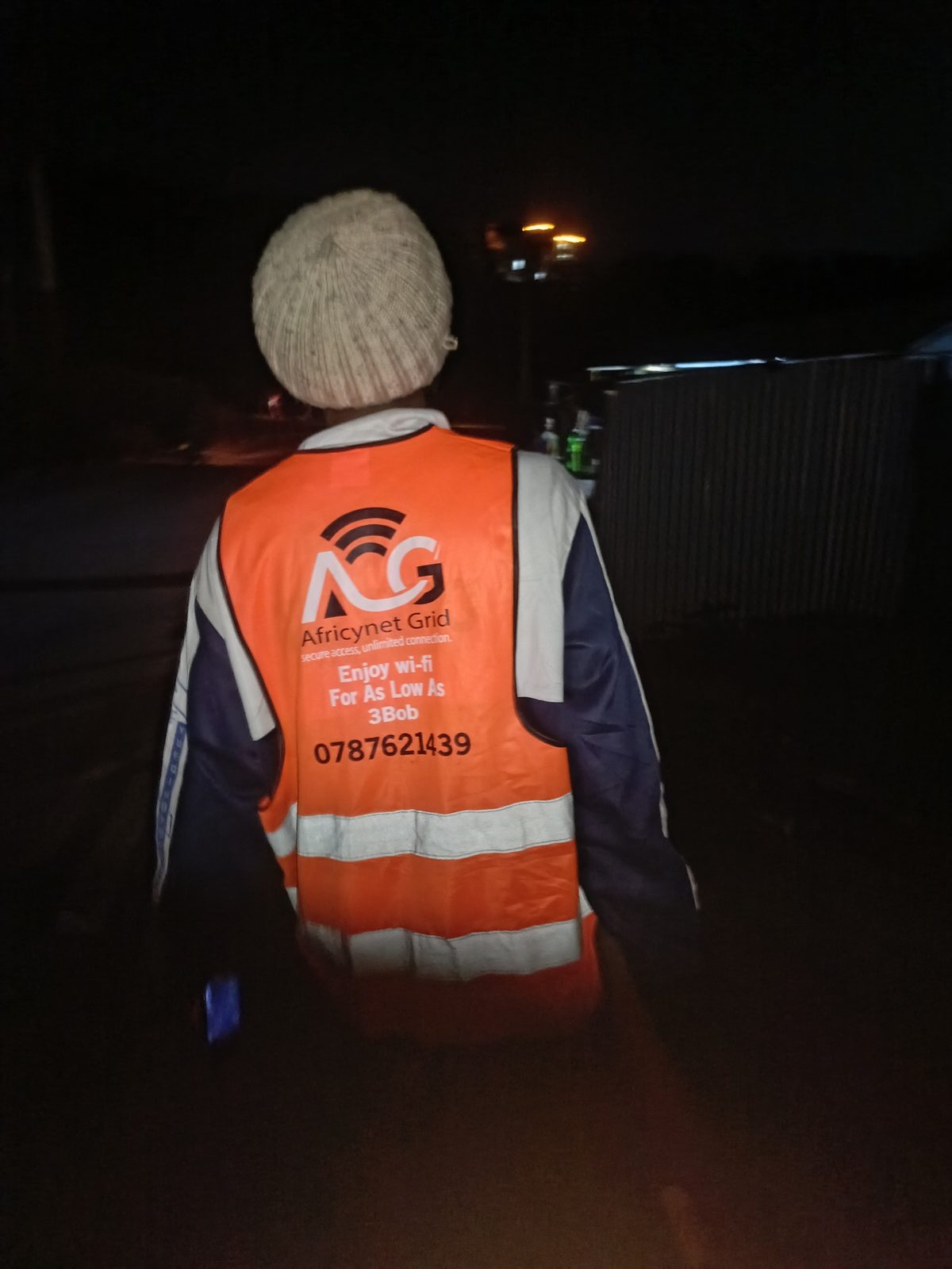 Africynet technician installing Wi-Fi at night