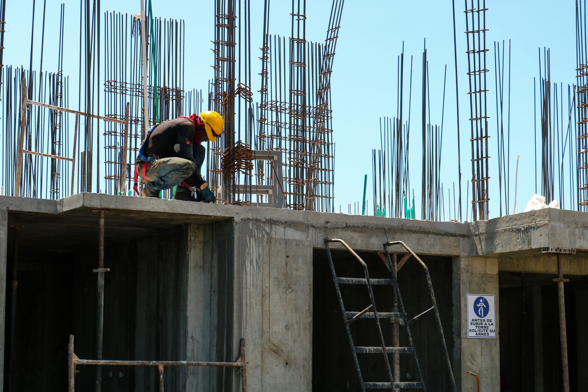 Construction worker on an unfinished concrete building floor